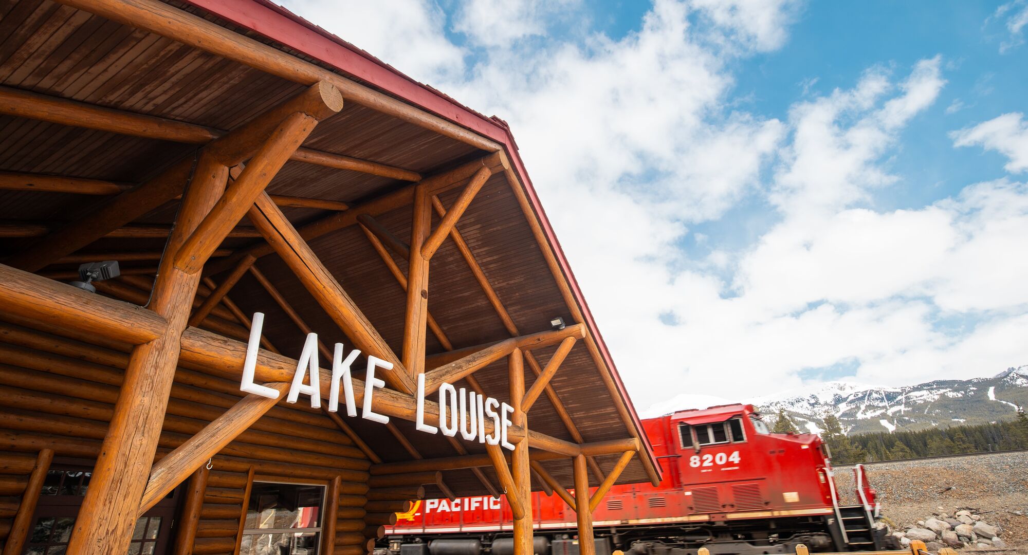 Historic train station restaurant in Lake Louise with mountain views and vintage railcar dining